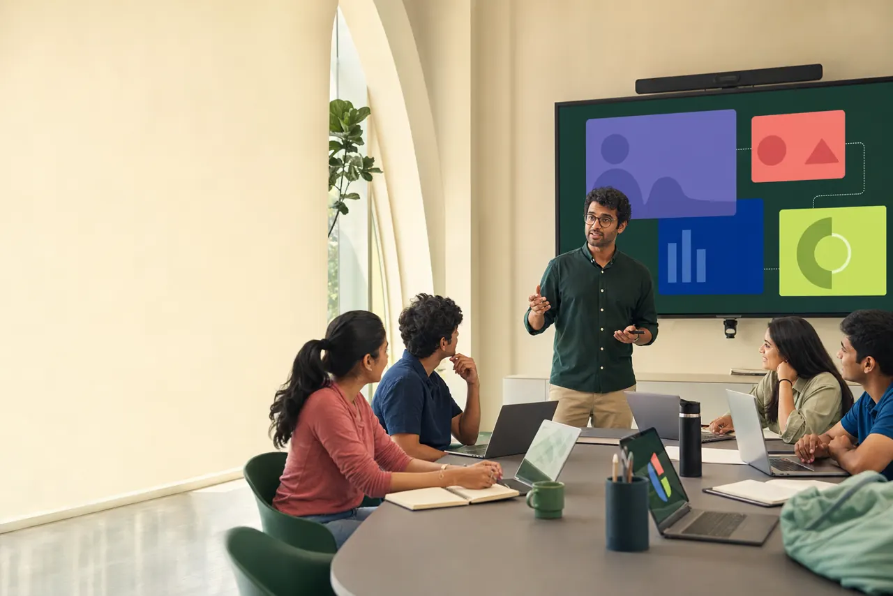 A teacher leads an engaged technology-supported university class.